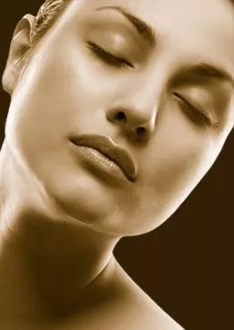 Photo of female model's face in septia tone